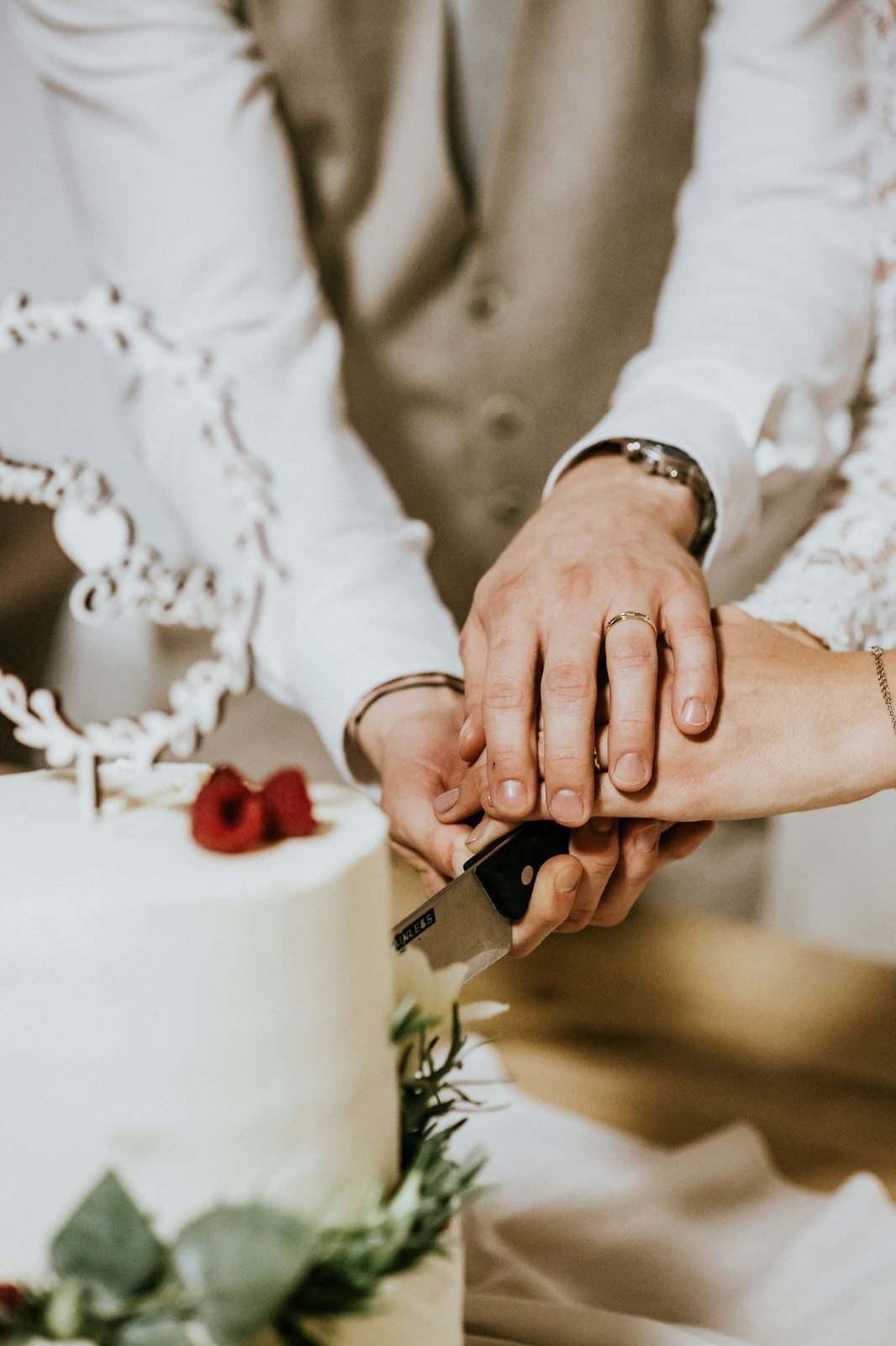 Couple cutting their wedding cake