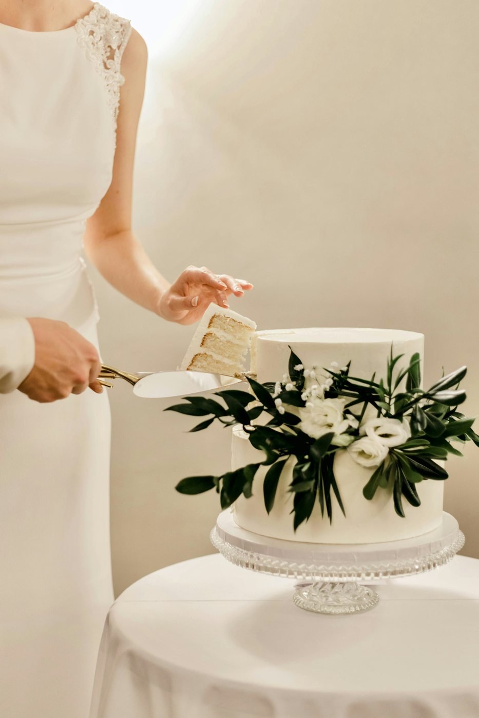 Cutting a wedding cake at a celebration