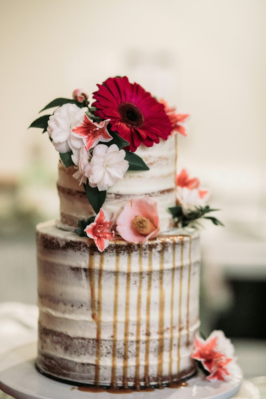 White iced cake with flowers on top